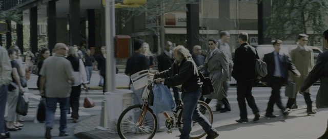 Wide shot frame from The Bourne Supremacy — walking, dialogue, street