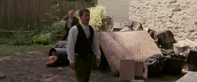 Wide shot frame from The Fighter — standing, walking, shirt