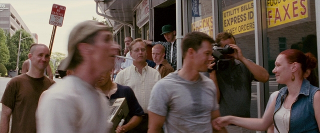 Wide shot frame from The Fighter — book, standing, dialogue