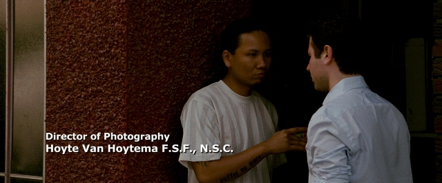 Wide shot frame from The Fighter — standing, dialogue, shirt