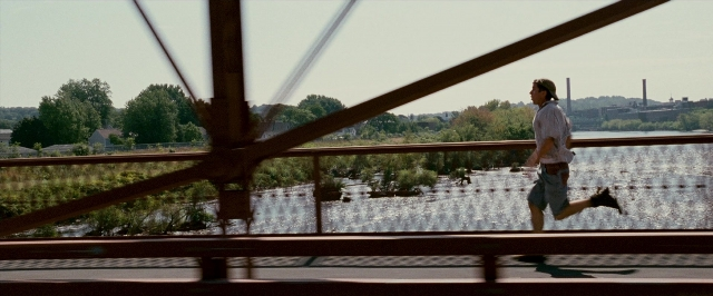 Wide shot frame from The Fighter — hat, shirt, person