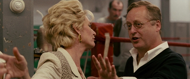 Wide shot frame from The Fighter — room, dialogue, hair