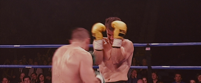 Wide shot frame from The Fighter — standing, fight, person