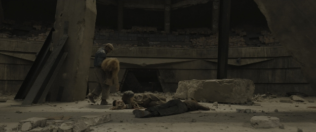 Wide shot frame from The Hunger Games: The Ballad of Songbirds & Snakes — standing, person, footwear