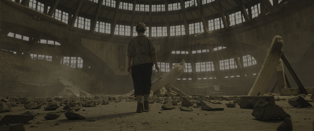 Wide shot frame from The Hunger Games: The Ballad of Songbirds & Snakes — standing, shirt, person
