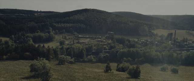 Wide shot frame from The Hunger Games: The Ballad of Songbirds & Snakes — standing, train