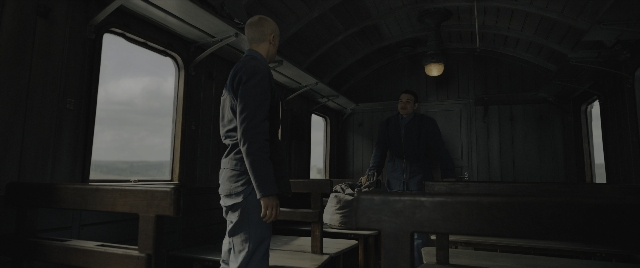 Wide shot frame from The Hunger Games: The Ballad of Songbirds & Snakes — standing, car, furniture
