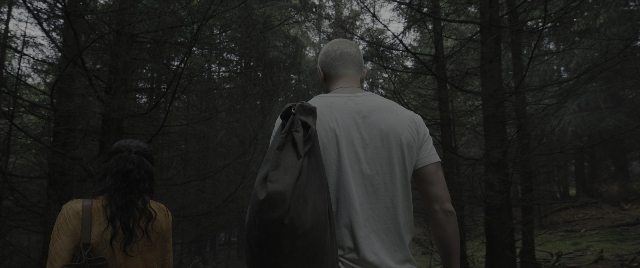 Wide shot frame from The Hunger Games: The Ballad of Songbirds & Snakes — walking, shirt, bag