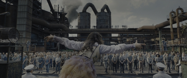 Wide shot frame from The Hunger Games: The Ballad of Songbirds & Snakes — standing, shirt, hair