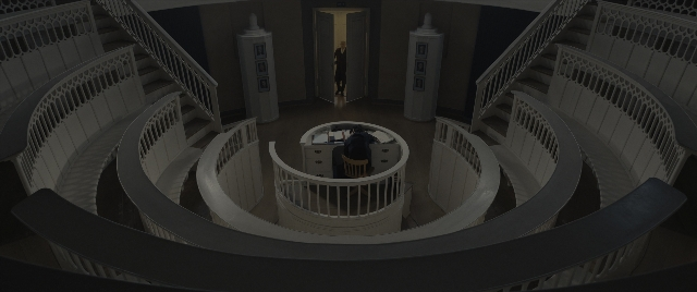 Frame from The Hunger Games: The Ballad of Songbirds & Snakes — sitting, table, door