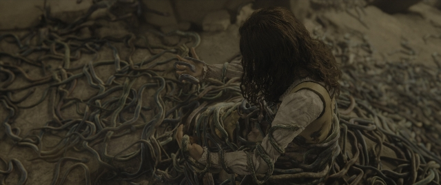 Wide shot frame from The Hunger Games: The Ballad of Songbirds & Snakes — sitting, hair, person