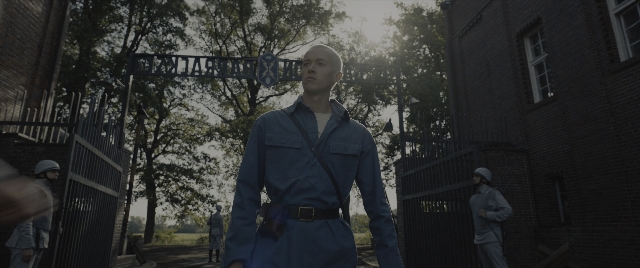 Wide shot frame from The Hunger Games: The Ballad of Songbirds & Snakes — standing, face, person