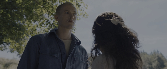 Wide shot frame from The Hunger Games: The Ballad of Songbirds & Snakes — standing, shirt, face