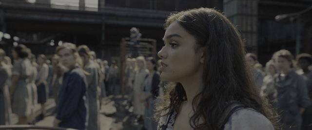 Wide shot frame from The Hunger Games: The Ballad of Songbirds & Snakes — standing, face, hair