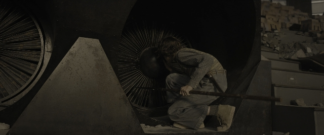 Frame from The Hunger Games: The Ballad of Songbirds & Snakes — hand, shirt, wheel