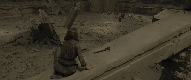 Wide shot frame from The Hunger Games: The Ballad of Songbirds & Snakes — sitting, walking, hand