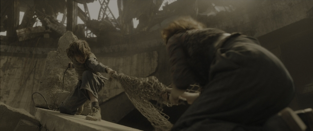 Wide shot frame from The Hunger Games: The Ballad of Songbirds & Snakes — standing, face, person