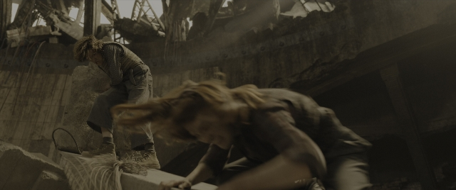 Wide shot frame from The Hunger Games: The Ballad of Songbirds & Snakes — standing, person, human face