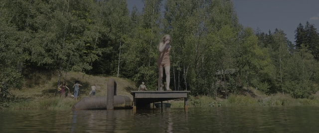 Wide shot frame from The Hunger Games: The Ballad of Songbirds & Snakes — standing, dialogue, phone