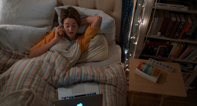 Wide shot frame from The Fault in Our Stars — book, room, table