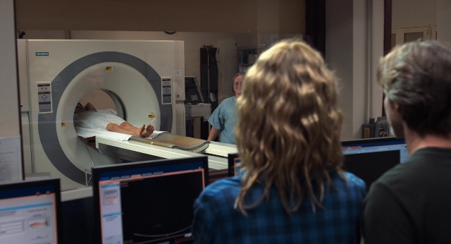 Wide shot frame from The Fault in Our Stars — room, bed, door