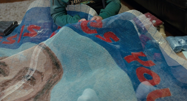 Frame from The Fault in Our Stars — sitting, room, dog