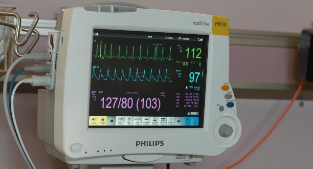 Wide shot frame from The Fault in Our Stars — digital clock