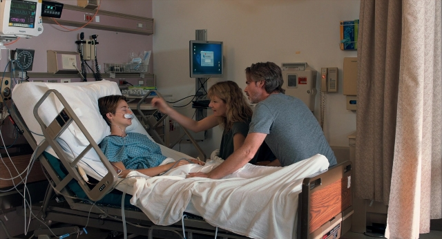 Wide shot frame from The Fault in Our Stars — standing, room, bed