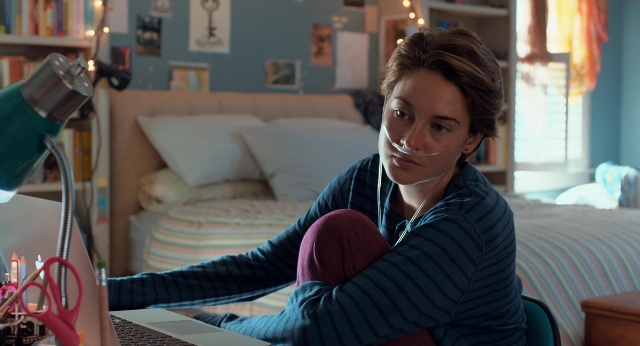 Medium shot frame from The Fault in Our Stars — sitting, room, bed