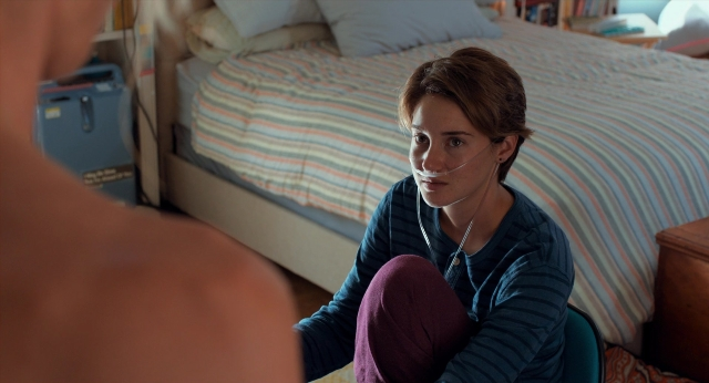 Wide shot frame from The Fault in Our Stars — sitting, room, bed