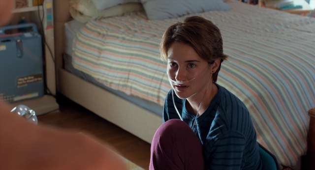 Frame from The Fault in Our Stars — sitting, room, bed