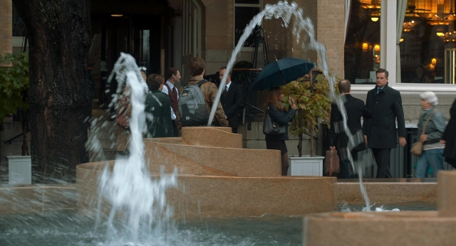 Wide shot frame from The Fault in Our Stars — water, umbrella, fountain