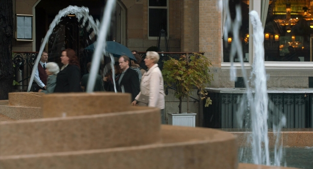 Wide shot frame from The Fault in Our Stars — walking, water, fountain