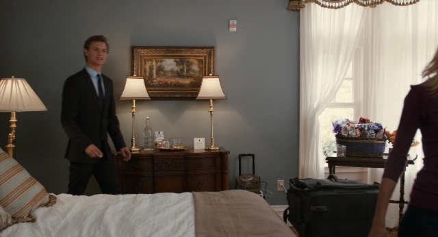 Wide shot frame from The Fault in Our Stars — standing, room, bed
