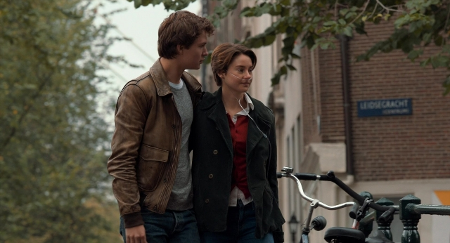 Wide shot frame from The Fault in Our Stars — standing, dialogue, street
