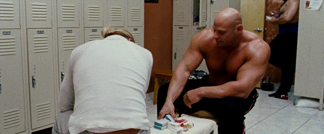 Wide shot frame from The Wrestler — sitting, room, mirror
