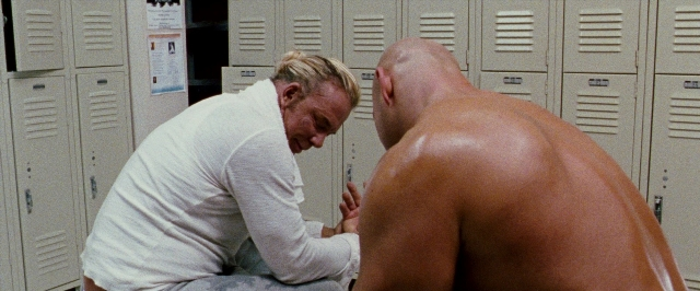 Frame from The Wrestler — standing, room, person