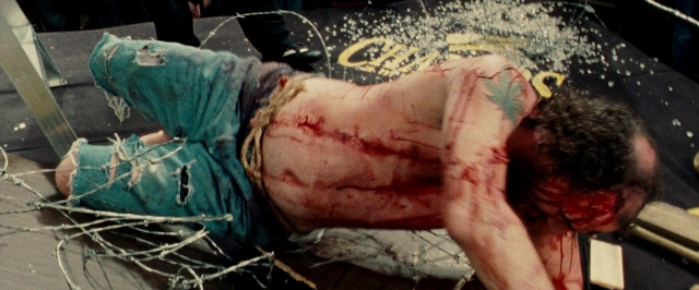 Wide shot frame from The Wrestler — standing, person, human face
