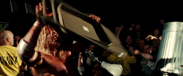 Wide shot frame from The Wrestler — night, shirt, hair