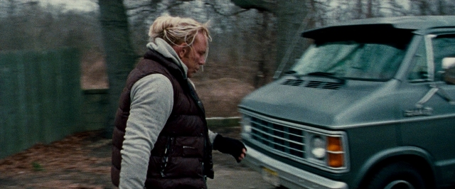 Wide shot frame from The Wrestler — standing, face, hair