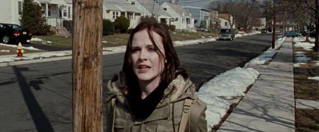 Wide shot frame from The Wrestler — standing, street, fire