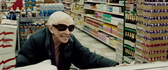 Wide shot frame from The Wrestler — sitting, hair, person