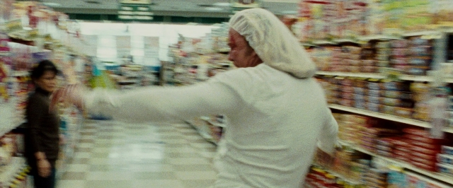 Frame from The Wrestler — standing, food, bag