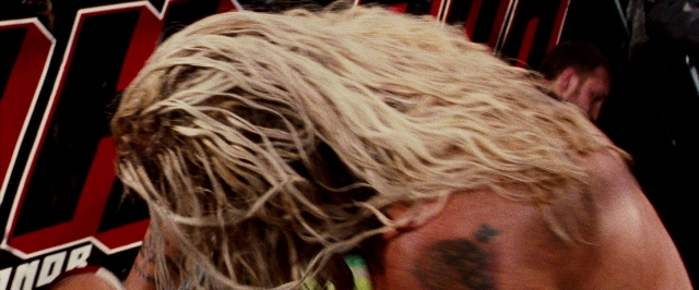 Wide shot frame from The Wrestler — hair, person, human face