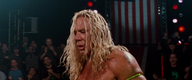 Wide shot frame from The Wrestler — standing, face, hair