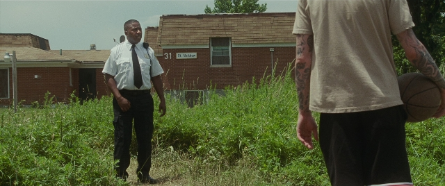 Wide shot frame from The King of Staten Island — standing, dialogue, tie