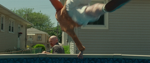 Wide shot frame from The King of Staten Island — shirt, person, human face