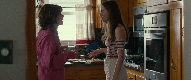 Wide shot frame from The King of Staten Island — standing, dialogue, kitchen