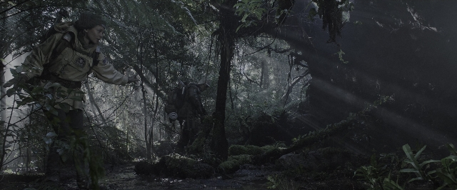 Wide shot frame from Alien: Covenant — walking, forest, person