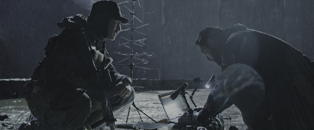 Wide shot frame from Alien: Covenant — room, hat, person